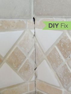 two tiles that have been torn off with the words diy fix on them