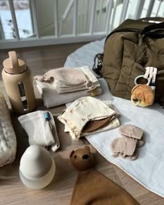 the contents of a baby's diaper laid out on top of a bed