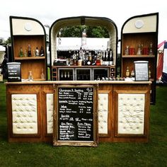 an old fashioned bar set up in the grass