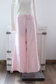 Vintage 70's bell bottom pants.  Pink and white gingham checked.  Wide bells.  Hip huggers.  Button at the waist with a zipper fly.  No pockets. Condition: Good condition.  There is a hole at the bottom of the pants leg, pictured.  A couple tiny spots. Brand: Sears JR Bazaar Fabric: no tag, feels like double knit polyester Measurements: Taken flat, then doubled when necessary. Size: no size tag, probably fits a size medium best Waistband: 33 in. Hips: 44 in. Length: 39 in. Inseam: 31 in. Rise: 1 Bell Bottoms Pants, Hip Huggers, Comfy Fall Sweaters, Vintage Baby Clothes, Womens Trousers, Pants Large, Bell Bottom Pants, Personalized Gifts For Her, Gingham Check