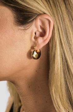 Easy-to-wear hoop earrings will add significant polish to even your most casual ensembles. 7/8" drop; 1/2" width Snap-post closure 14k-gold plate or rhodium plate Imported Cadmium-free Drop Earrings, Gold-tone Tarnish Resistant Teardrop Hoop Earrings, Gold Teardrop Hoop Earrings Tarnish Resistant, Tarnish Resistant Teardrop Huggie Earrings, Gold-tone Polished Earrings, Polished Gold-tone Earrings, Gold Teardrop Huggie Earrings For Everyday, Polished Finish Gold Plated Hoop Earrings, Nickel Free Brass Huggie Earrings