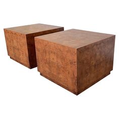 two square wooden tables sitting next to each other