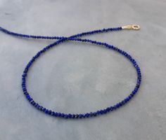 Lapis lazuli chocker necklace Minimalist natural Lapis lazuly necklace,made with tiny 2mm faceted lapis beads and 14k solid gold clasp. Super dainty ,delicate necklace, a little beauty on your neck Great timeless gift for anniversary,birthday,graduation Measures : Length-please select in the drop down menu 2 mm lapis beads Clasp-please select fish lock or spring clasp.see picture Lapis Lazuli Jewelry With Faceted Beads For Gift, Lapis Lazuli Faceted Beads Jewelry For Gift, Faceted Lapis Lazuli Beads Jewelry For Gift, Beaded Chocker, Anniversay Gifts, Lapis Jewelry, Dangle Earrings Wedding, Lapis Necklace, Pearl Earrings Wedding