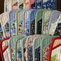 a close up of many quilted place mats