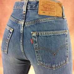 "Size 28 Vintage Levi's 501 Jeans - W28 L33 - Button Fly Jeans - 90' Jeans Slim Fit Tapered Leg - Red Tab - Made in USA, waist 28\" Medium Brand: LEVIS 501 Size On Tag marked W29 L32 but fits more like 28\" waist, 11.75\" rise, 23.5\" thighs, 42\" hips, 33\" inseam, 14.5\" leg opening! Fits a size 28, but check your measurements and compare the measurement with your garment. (see full measurement below) Recommended waist size: 28\" (28x33) *size 28 for a waist of 28 inches, expect your jeans to measure about 14\" across at the waist (Doubled 28\") to fit. Please follow our measurement guide: https://www.instagram.com/p/B2o273Kl5Oi/?igshid=1q5azikfj59p4 Material :  Cotton 100% Made In USA Measurements:- All measurements are taken with the garment laying flat, doubled for the Waist, hip &, e Vintage Fitted Jeans With Button Closure, Vintage Mid-rise Jeans With Buttons, Red Fitted Vintage Jeans, Fitted Vintage Red Jeans, Levis 501 Women, Levi 501 Jeans, Levis 501 Jeans, Levis Vintage, Vintage Levis 501