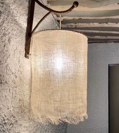 a lamp hanging from the ceiling in a room