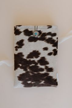 Embrace rustic charm with our Cowhide Book Sleeve! Crafted from faux cowhide and featuring a stunning concho turquoise button closure, this sleeve is perfect for hardback books. Protect your favorite reads in Western style and add a unique touch to your bookshelf. Ideal gift for book lovers!Introducing Our Luxurious Faux Suede Cowhide Book Sleeve with Concho Turquoise Button Closure!" Discover sophistication and durability with our latest launch, the Faux-Suede Cowhide Book Sleeve. This isn't ju Hardback Books, Western Books, Faux Cowhide, Western Gifts, Book Sleeve, Cute Cows, Book Accessories, Cow Print, Book Lovers Gifts