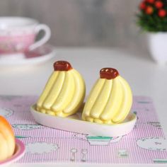 there are two pieces of cake in the shape of banana's on a plate