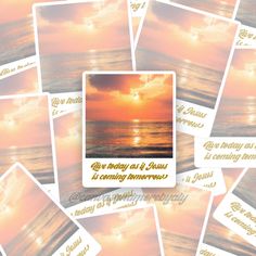 a bunch of cards with some pictures on them and the sun setting in the background