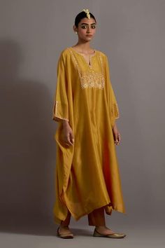 Buy Yellow Chanderi Hand Embroidered Zari Notched Yoke Kaftan With Pant For Women by Deep Thee Online at Aza Fashions. Traditional Yellow Wedding Kaftan, Gold Embroidered Anarkali Kaftan, Yellow Silk Dress With Chikankari Embroidery, Yellow Kaftan For Wedding And Festivals, Bohemian Yellow Kurta With Zari Work, Festivals Straight Kurta Kaftan With Gota Work, Festival Straight Kurta Kaftan With Gota Work, Gold Kaftan With Dabka Detailing, Yellow Long Sleeve Festival Kaftan