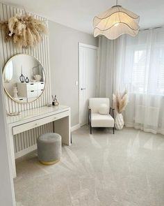 a room with a white chair and a mirror on the wall