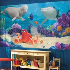 an ocean scene with dolphins and octopuses on the sea wall mural in a children's room