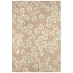 a beige and white rug with sand dollars on it's side, in the shape of shells