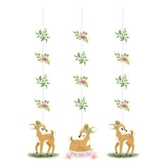 three deer mobiles hanging from strings with flowers on the top and one is holding a sign