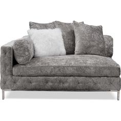 a gray couch with pillows on top of it