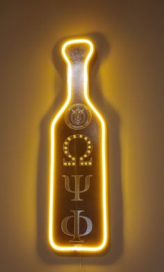 a lighted liquor bottle sign hanging on the wall