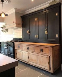 a kitchen with an oven, stove and cabinets