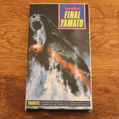 a book about the final yamato on a wooden table with an image of a fighter jet