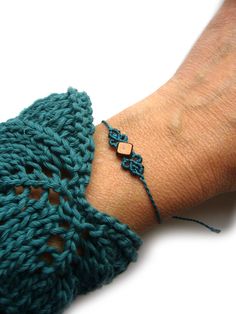 a person's arm with a bracelet on it