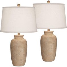 two ceramic lamps with white shades on them