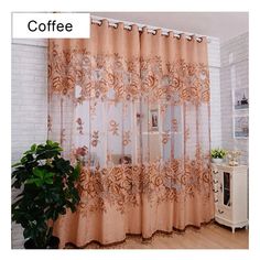 the curtains are hanging on the wall in front of the window, and there is a potted plant next to it