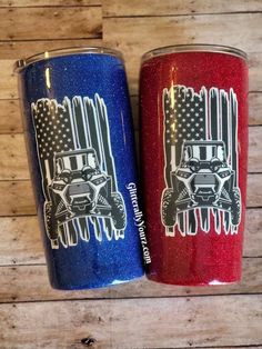 two red, white and blue tumblers sitting next to each other on a wooden surface