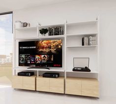 a white entertainment center with bookshelves and movies