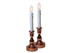 two candles are sitting next to each other