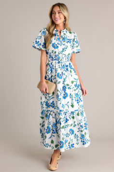 Make a statement in our Only Bliss Blue Floral Maxi Shirt Dress. Bold blooms adorn this flowy maxi dress, perfect for any occasion. Stand out in this blue floral masterpiece. This blue floral dress features a stretchy waistband, small V-neck and blue appliqué florals.  Self 100% Cotton Lining: 97% Polyester 3% Spandex Hand Wash Cold Designed in USA  Manufactured in China Model is wearing a size Small Dresses Office, Floral Long Dress, Halter Bridesmaid Dress, Elastic Waist Dress, Blue Floral Dress, Shirred Dress, Maxi Shirts, Flowy Maxi Dress, Maxi Shirt Dress