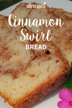 two slices of cinnamon swirl bread on a white plate with pink flowers and green leaves