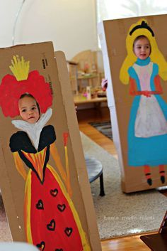 two children's paper cut outs with princesses on them, one is wearing a red dress and the other has a yellow crown