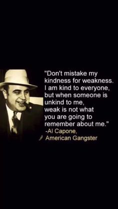 a man in a hat and suit with an american gangster quote on the back ground