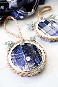 two blue plaid ornaments hanging from twine