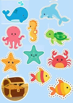 an assortment of sea animals stickers on a blue background