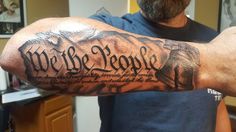 a man with a tattoo on his arm that says we are people