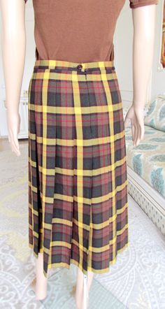 "Yellow plaid skirt 90s Pleated Skirt womens skirt Vintage halloween costume halloween Skirt Boho Skirt Midi Skirt 10 height of the woman in the photo - 180 cm Please refer to photos for details of condition. Condition: very good vintage Measurements: Length: 75 cm/29.6 \" Waist 70 cm/27.6\" Hips: FREE Size UK 10 EURO 36 note The color on the pictures may vary due to monitor settings and light reflections. Ready to ship Please do not hesitate to contact with me for any questions. Thank you for s Fitted Full Skirt In Plaid, Retro Fitted Plaid Skirt, Fitted Retro Plaid Skirt, Plaid Skirt Outfits Summer, 90s Pleated Skirt, Yellow Plaid Skirt, Broomstick Skirt, Plaid Skirt Outfit, Long Fur Coat