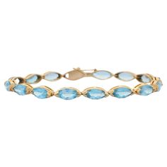 This Modern Marquise Blue Topaz Tennis Bracelet in 14K gold showcases 16 endlessly sparkling natural blue topaz, weighing 18.9 carats. It measures 8 inches long in length. Blue topaz helps to improve communication and self expression. Designed with perfect marquise cut blue topaz set horizontally in solid gold settings in repetition making a beautiful bracelet to make you stand out on any occasion or event. The elegant style complements the attire beautifully and this is a perfect Unique Gift, B Slide Bracelet Charms, Topaz Yellow, Slide Bracelet, Blue Topaz Bracelet, Gold Topaz, Modern Bracelets, Mother Daughter Gifts, Blue Topaz Stone, Improve Communication