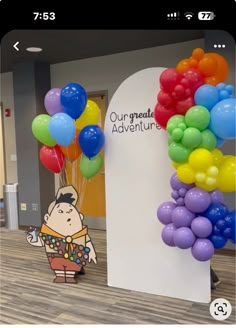 the balloon arch is decorated with colorful balloons