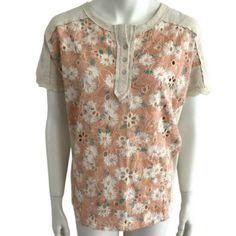 From Miss Me Comes This Oatmeal Floral Combo Short Sleeve Embroidered Eyelet Tee In Sz Small. Features Mother Of Pearl Henley Style Button Front Closure, V Yoke In Back With Crochet Inlay Accent, Raw Seams, Crochet Detail On Hem Of Sleeves, Allover Embroidered Eyelet Front In Peach And White Floral. Measurements Bust Flat 24" Length 24.5". Fabric 95% Cotton 5% Spandex. Extra Button Included Apricot Short Sleeve Cotton Tops, Apricot Cotton Short Sleeve Tops, Heather Peach Cotton Tops For Spring, Orange Cotton Top With Floral Embroidery, Orange Floral Embroidered Cotton Top, Orange Short Sleeve Tops With Floral Embroidery, Orange Floral Embroidered Short Sleeve Tops, Orange Floral Embroidery Short Sleeve Tops, Rhinestone Tees