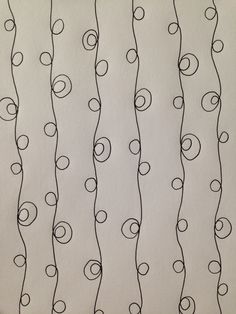 a drawing of black and white lines with circles on them