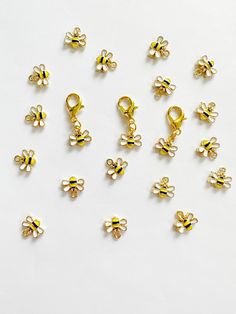 small yellow and black bee charms on a white surface