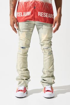 SERENEDE® "SULFUR" stacked jeans feature a light blue wash with bleached accents, a fitted construction, and a stacked finish. Go with your regular waist size. This style fits like our usual sizing with added stack to the bottom of the leg. THIS STYLE IS A STACKED JEAN AND HAS A WIDER LEG OPENING. PLEASE ORDER YOUR USUAL SIZE FOR THIS PARTICULAR LOOSER FIT AROUND YOUR LEGS. DETAILED FEATURES: Stretchability: MEDIUM STRETCH Vintage light blue denim base with bleached fading Distressing throughout Urban Style Light Wash Fitted Jeans, Light Wash Fitted Urban Jeans, Urban Style Fitted Light Wash Jeans, Fitted Light Wash Urban Jeans, Urban Style Light Wash Flare Jeans For Streetwear, Ripped Light Wash Flare Jeans For Streetwear, Light Wash Denim Flare Jeans For Streetwear, Fitted Faded Jeans For Streetwear, Urban Style Distressed Fitted Flare Jeans