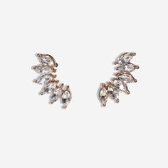 These wing flare post style earrings will give you an elegant yet bold look! Make a statement with this chic and stylish statement piece. Rock on, and look good doing it! Trendy Ear Cuff With Matching Earrings For Party, Chic Crystal Drop Earrings, Chic Crystal Earrings, Chic Silver Earrings For Night Out, Elegant Wing-shaped Earrings For Party, Elegant Wing-shaped Party Earrings, Elegant Ear Climbers For Party, Wing-shaped Earrings For Party, Rock On