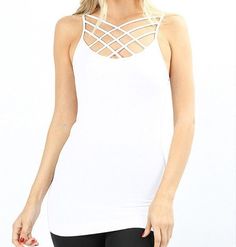 Our Criss Cross Cage Cami is the perfect piece that is sure to add tons of versatility to your collection! Wear this tank with your favorite jeans and baseball cap for a casual look! Also, try layering this tank with cardigans and jackets for the perfect spring look! Also try stack layering the camis for a unique look. SIZE CHART All measurements are in inches, unstretched to a comfort stretch. Size S/M L/XL 1X/2X 2X/3X Bust 28-36" 30-38" 33-43" 35-45" Hip 28-36" 30-38" 33-43" 35-45" Length 27.5 Trendy Spring Crisscross Tops, Trendy Stretch Crisscross Tops, Spring Stretch Strappy Top, Edgy Racerback Tank Top For Spring, Trendy Racerback Tops For Day Out, Trendy Crisscross Summer Tops, Trendy Summer Crisscross Top, Trendy Summer Tops With Crisscross Shape, Trendy Crisscross Top For Summer