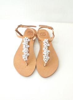 Pearl sandals, Bridal sandals, Wedding sandals, Greek leather sandals, Decorated sandals with white pearls, Beach wedding flats This pair is made of genuine Greek leather and is decorated with acrylic white pearls. Elegant leather sandals, a must have accessory for the summer. It's a great gift for a bride or your bridesmaids. They could be perfect for any woman who wants to make a difference & wear something special every day. *All sandals are made of Genuine Greek Leather! *You'll receive it i Pearl Open Toe Sandals For Summer, Summer Pearl Open Toe Sandals, Pearl Embellished Open Toe Sandals For Summer, Leather Sandals For Summer Weddings, Summer Wedding Leather Sandals, Sandals Greek, Sandals Wedding, Pearl Sandals, Bridal Sandals