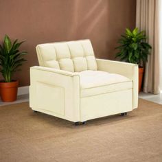 a white chair sitting on top of a carpeted floor next to potted plants