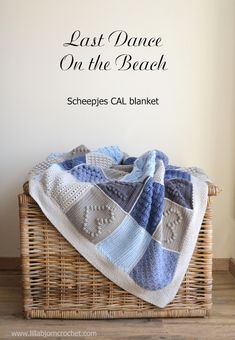 a crocheted blanket sitting on top of a basket