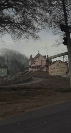 an old building with a sign for pink palace apartments on the side of the road