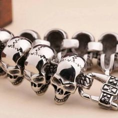 Silver Skull Print Bracelets As A Gift, Punk Metal Skull Ring For Streetwear, Edgy Skull Metal Bracelets, Edgy Skull-shaped Metal Bracelets, Edgy Metal Skull Bracelets, Gothic Stainless Steel Skull Bracelets, Punk Silver Skull Bracelets, Silver Punk Style Wristband Gift, Silver Skull Bracelets In Punk Style