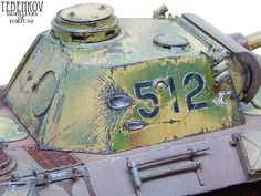 a close up of a toy tank with numbers on the front and side panels that read 512